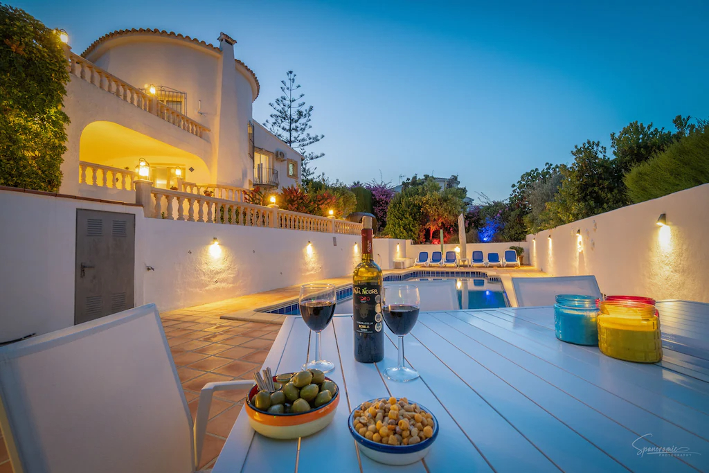 Villa and pool area at night