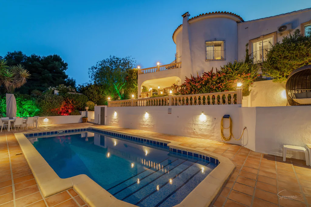 Villa and pool area at night