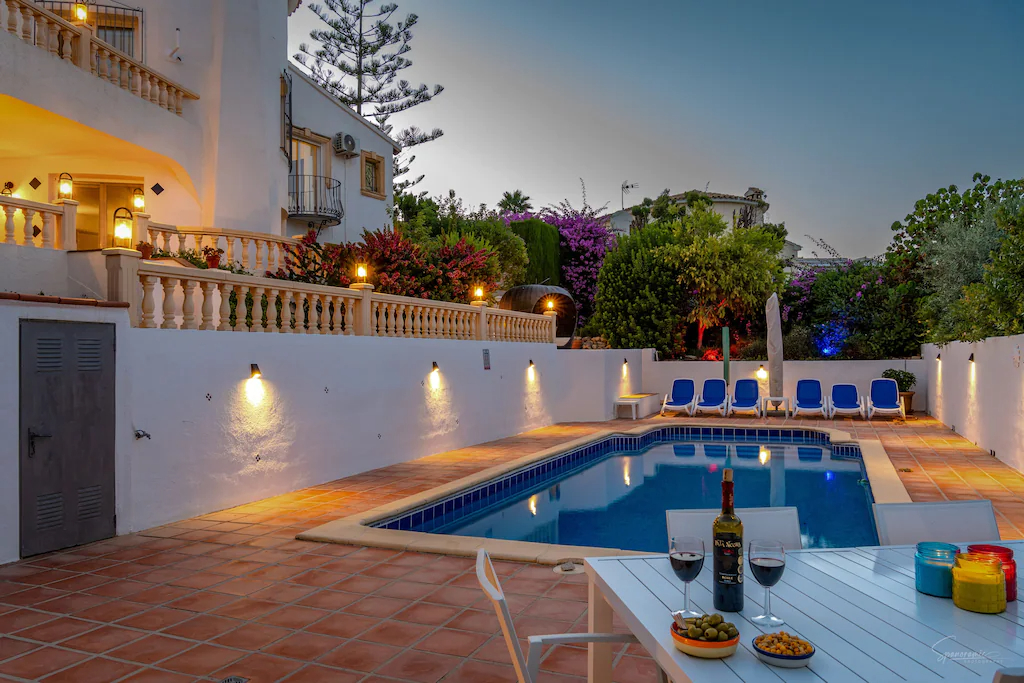 Villa and pool area at night